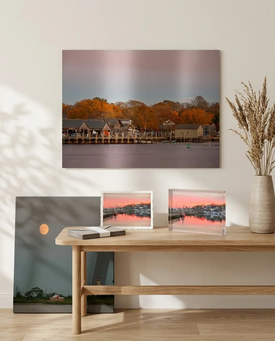 Sandra Falcetta’s coastal photographs as a metal print on the wall, a canvas, a paper print and an acrylic block arranged around a wooden bench