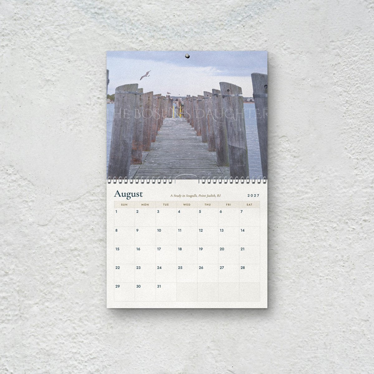 August page of the Seagulls 2027 calendar: a weathered pier at Point Judith, Rhode Island